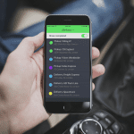 Man holding a mobile phone with open GSMtasks app