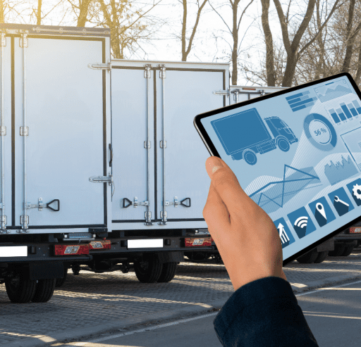 Man holding a tablet and moving trucks