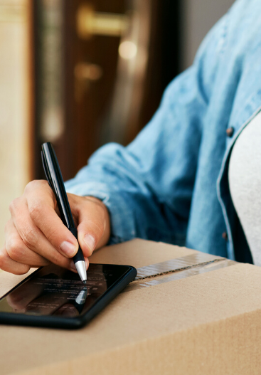 Customer giving a signature after receiving the goods